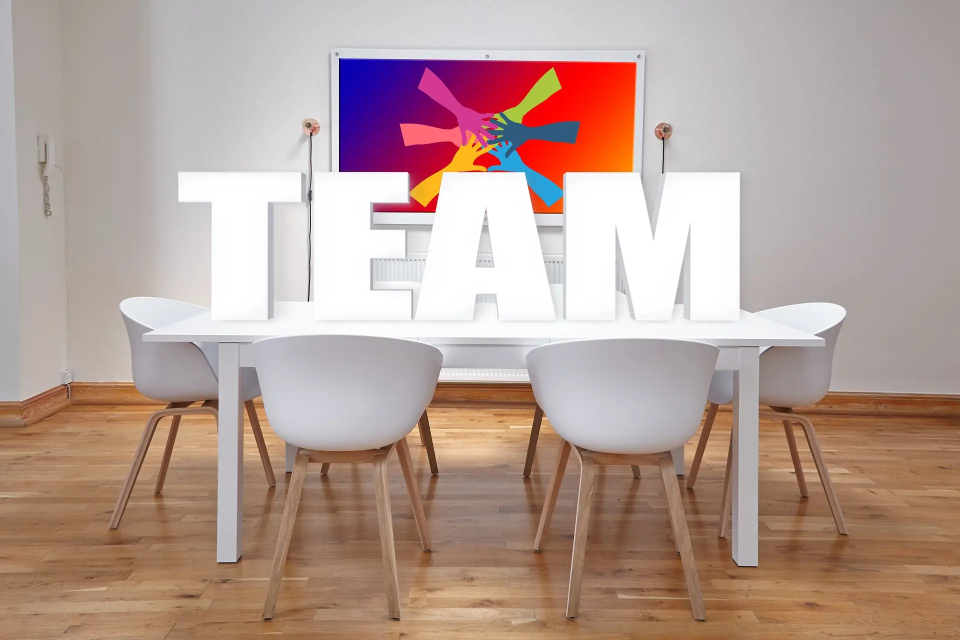 Meeting room with large white letters spelling team